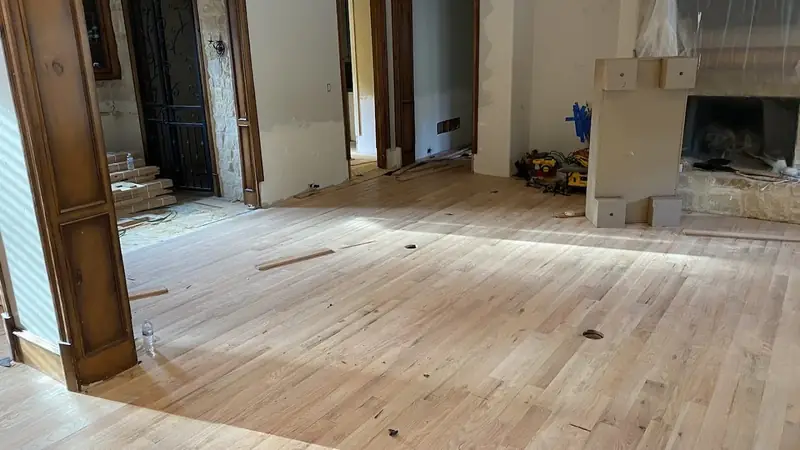 Hardwood floor sanded to bare wood during refinishing